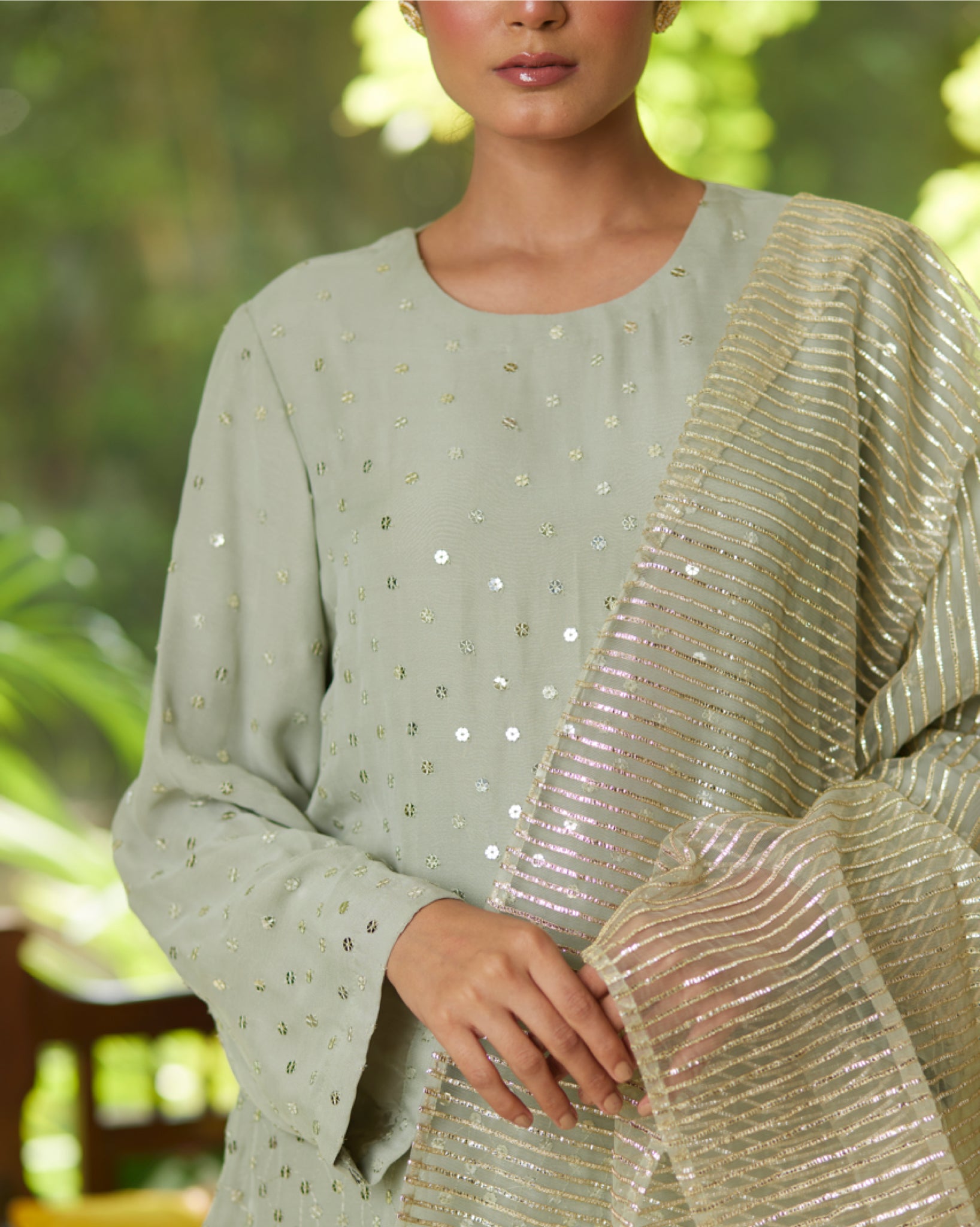 Mayura Kumar sequin stardust kurta set in mint, gold and silver, side view