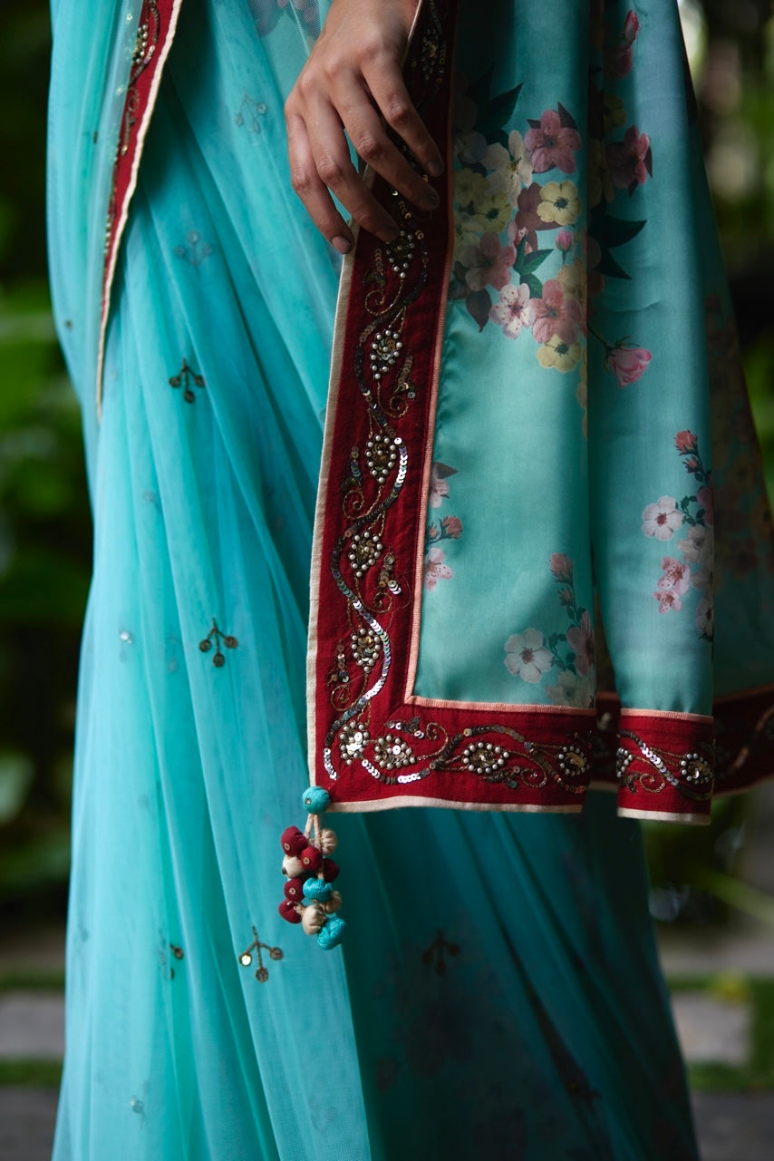 Mayura Kumar floral saree in aqua, peach and red, back view