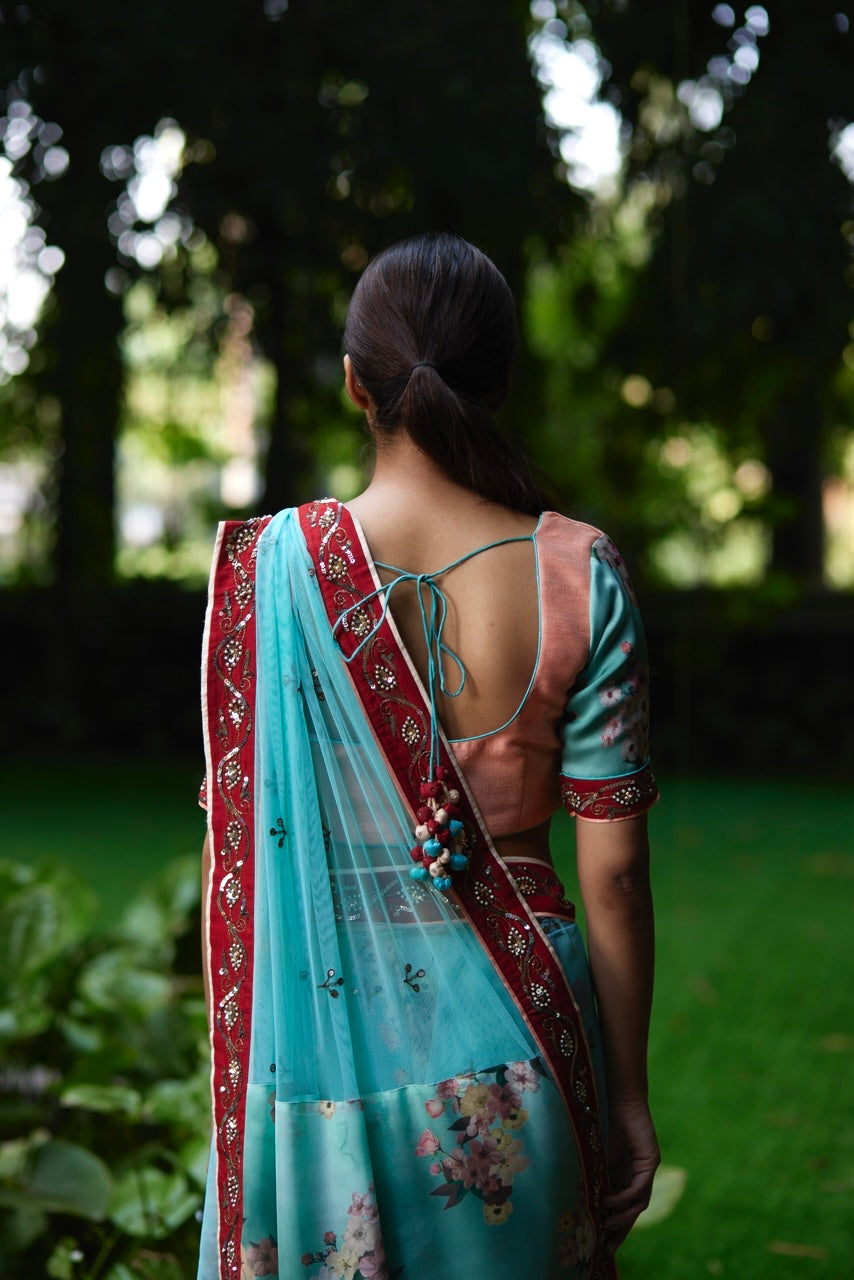 Mayura Kumar floral saree in aqua, peach and red, close-up detail