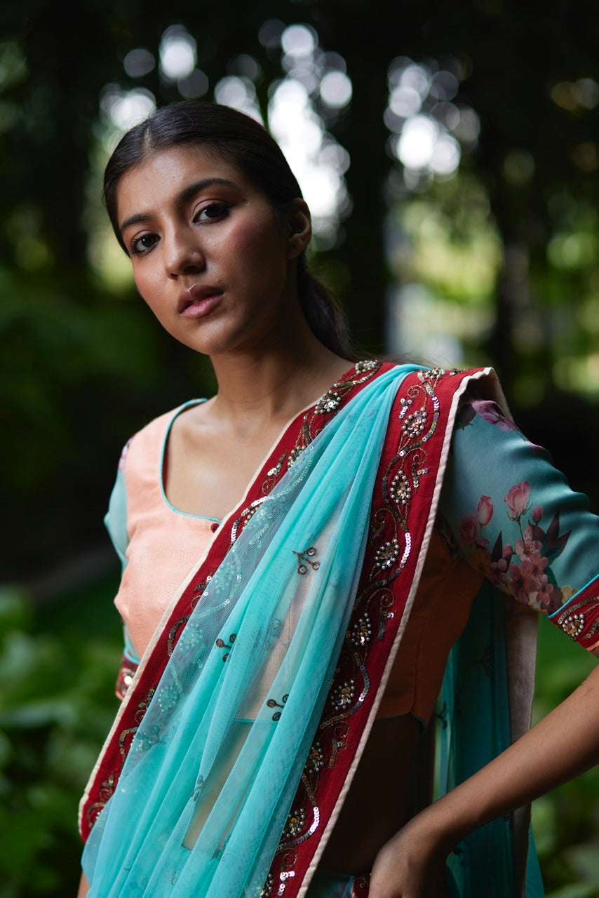 Mayura Kumar floral saree in aqua, peach and red, styled view